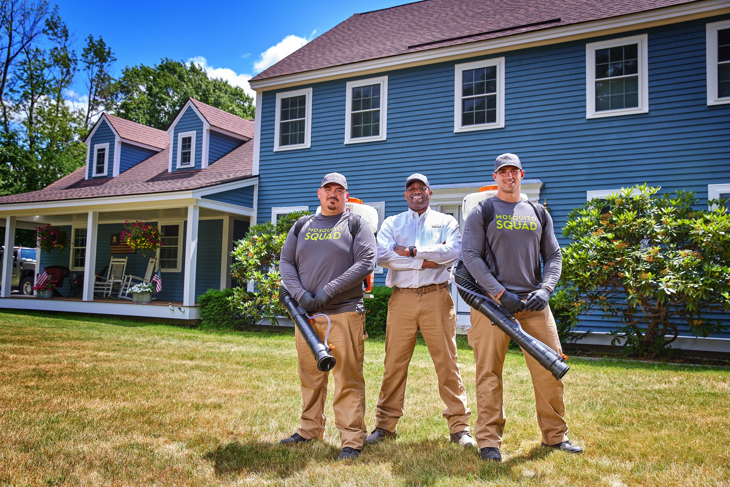 Two Mosquito Squad employees standing together