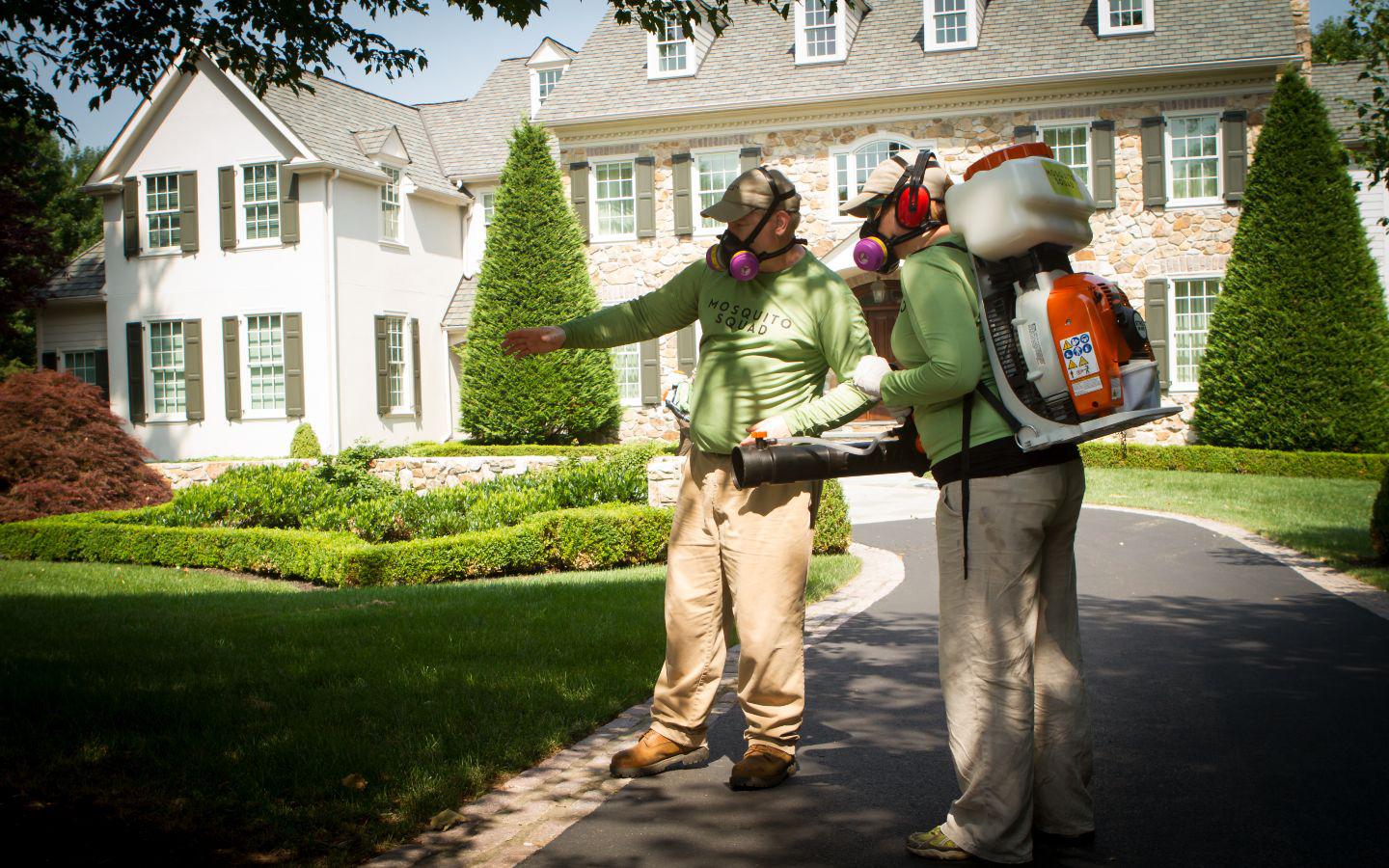 pest control workers in gear