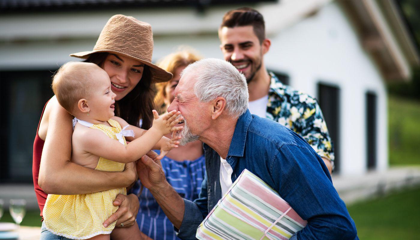 a man smiling at baby