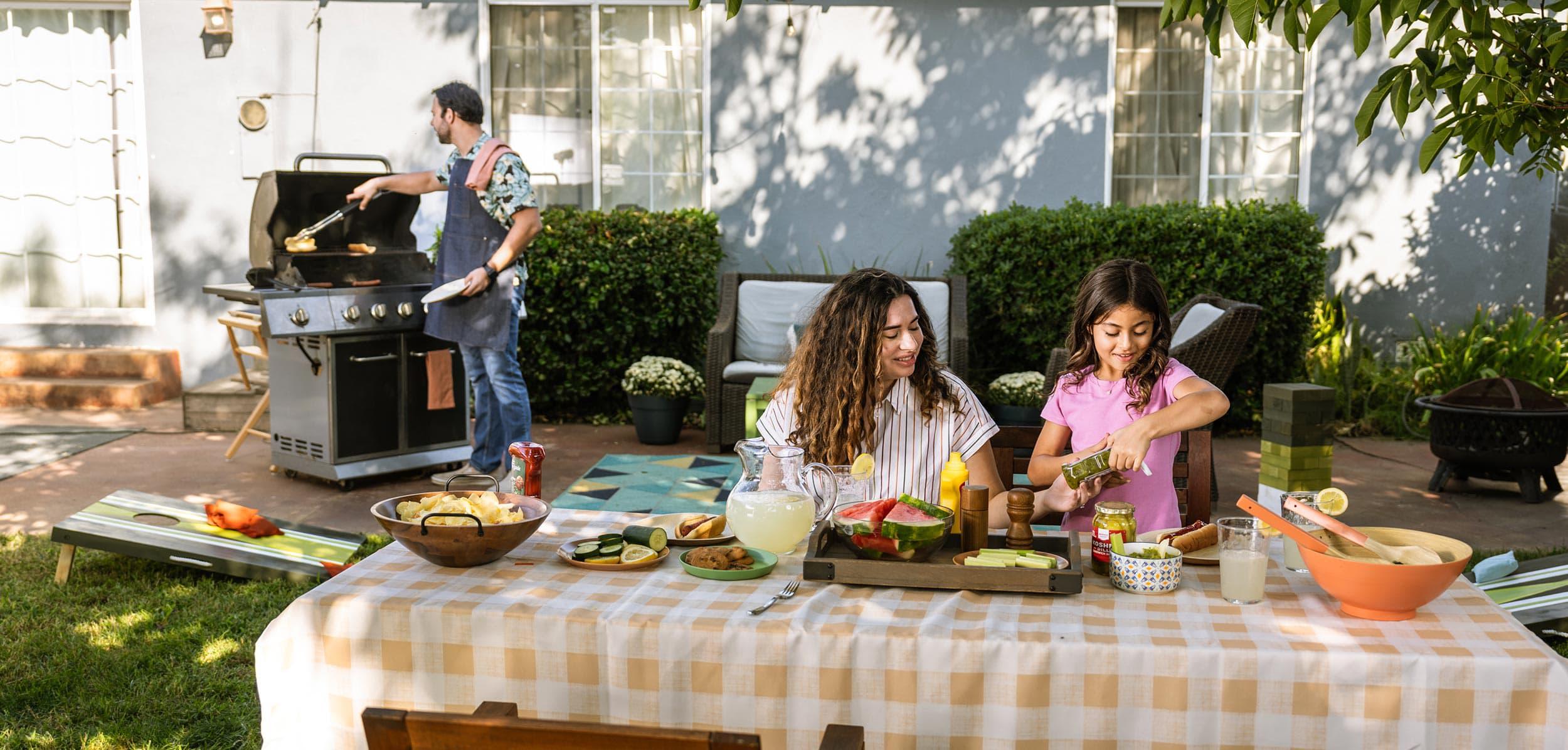 A family having a backyard picnic