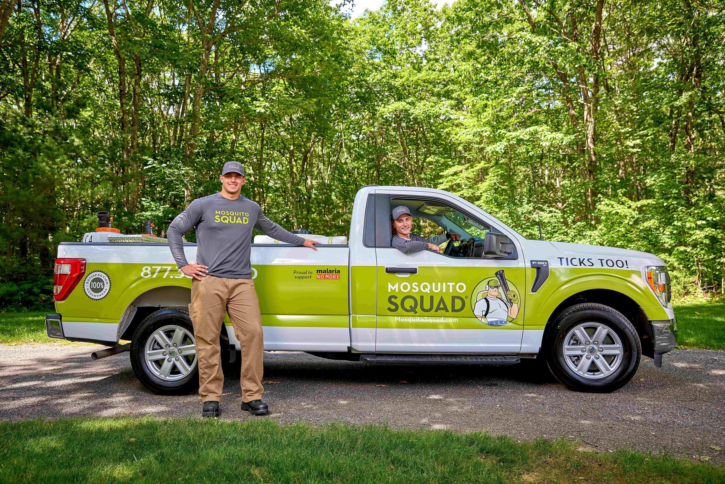 Mosquito Squad truck and two employees