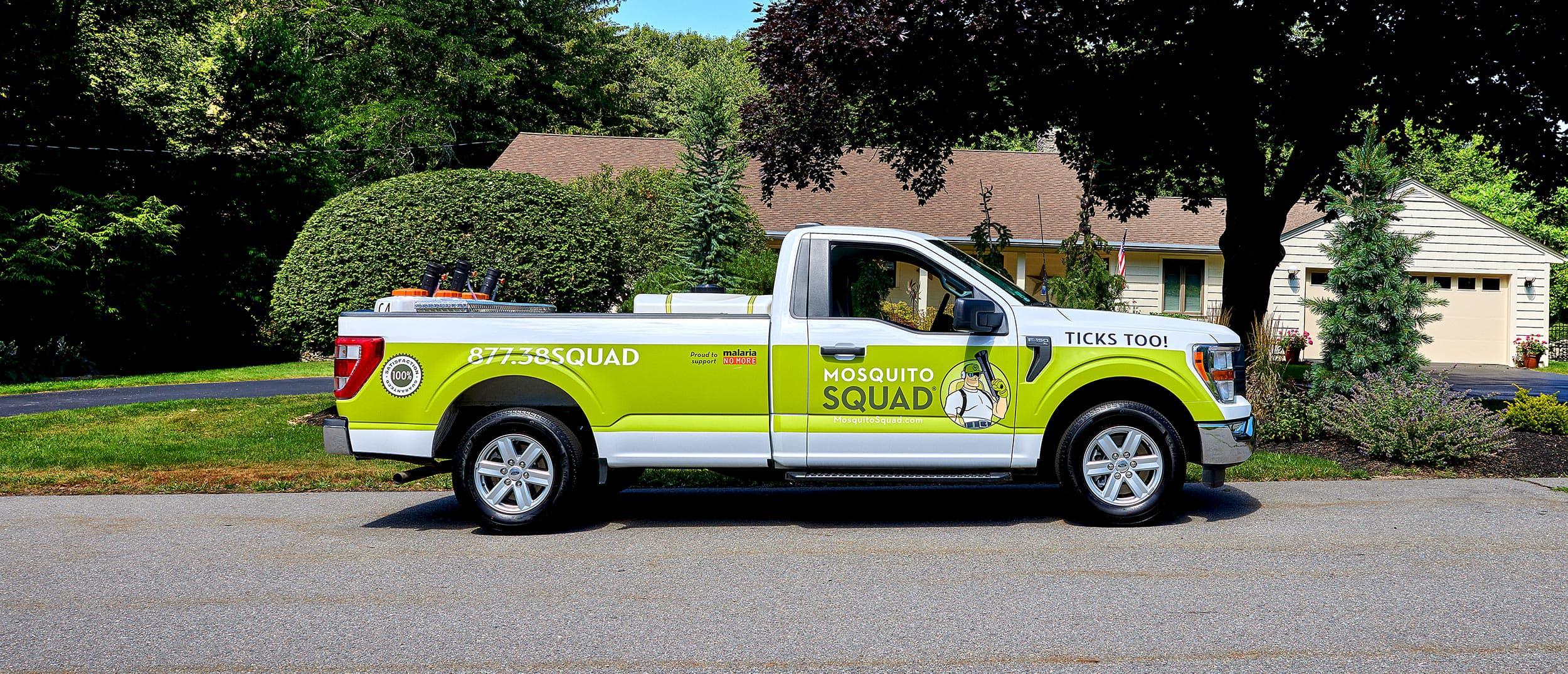 A Mosquito Squad truck parked on street